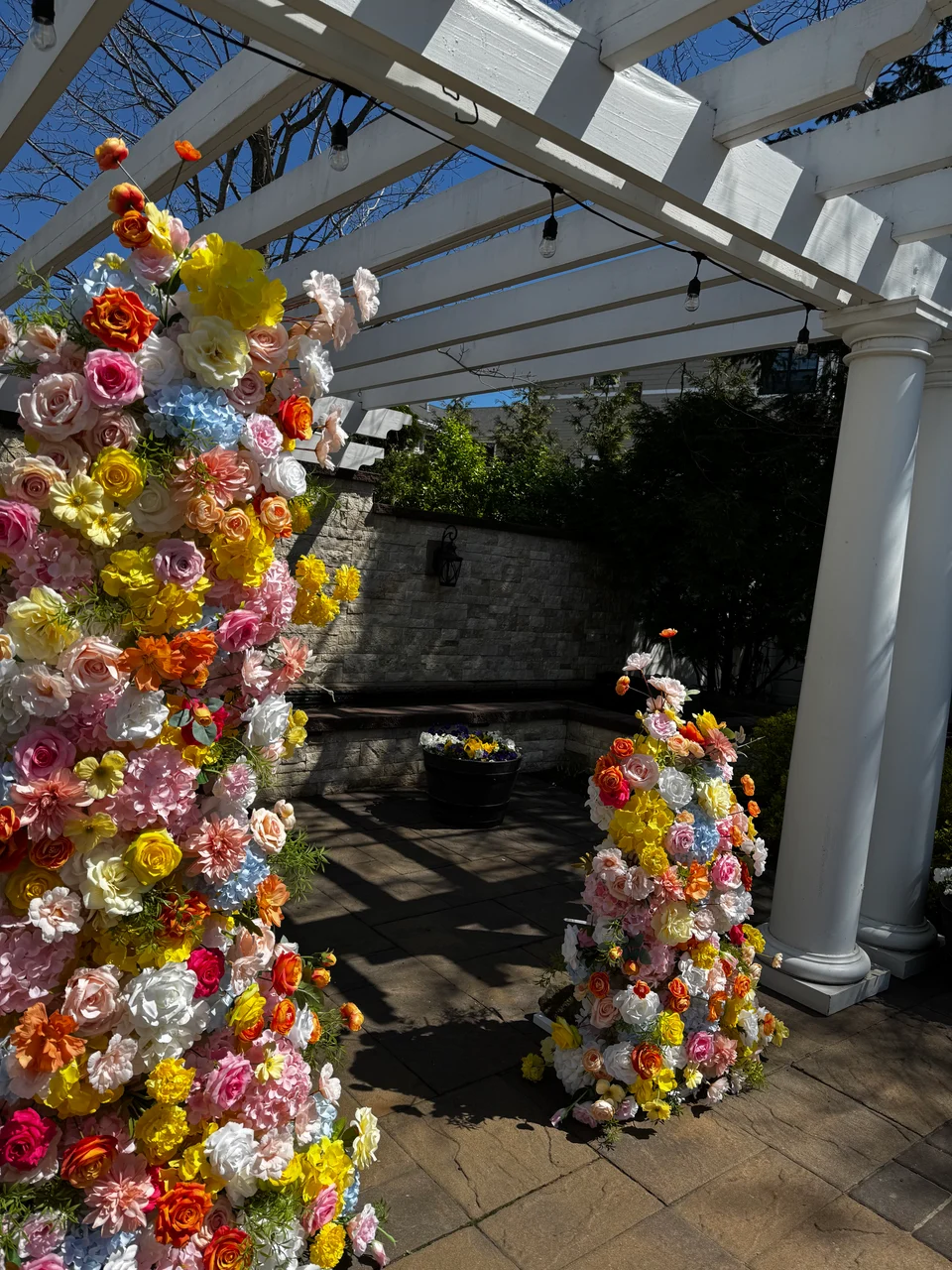 Colorful floral arch framing an event entrance